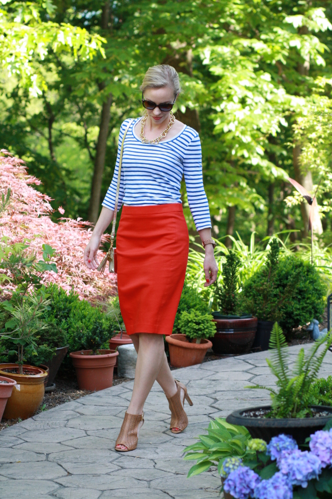 blue striped boatneck tee, gold chain link necklace, red pencil skirt, gold Brahmin Amelia bag, tan perforated leather peep-toe booties