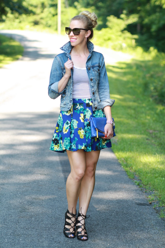 J. Crew cropped distressed denim jacket, black and white striped tank, high waist floral skirt, lace up open-toe booties, Chanel sunglasses, cobalt blue Brahmin clutch
