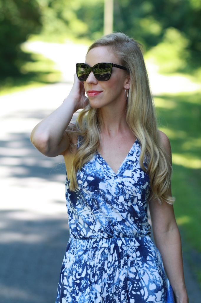 black oversized Chanel cateye sunglasses, blue floral maxi dress