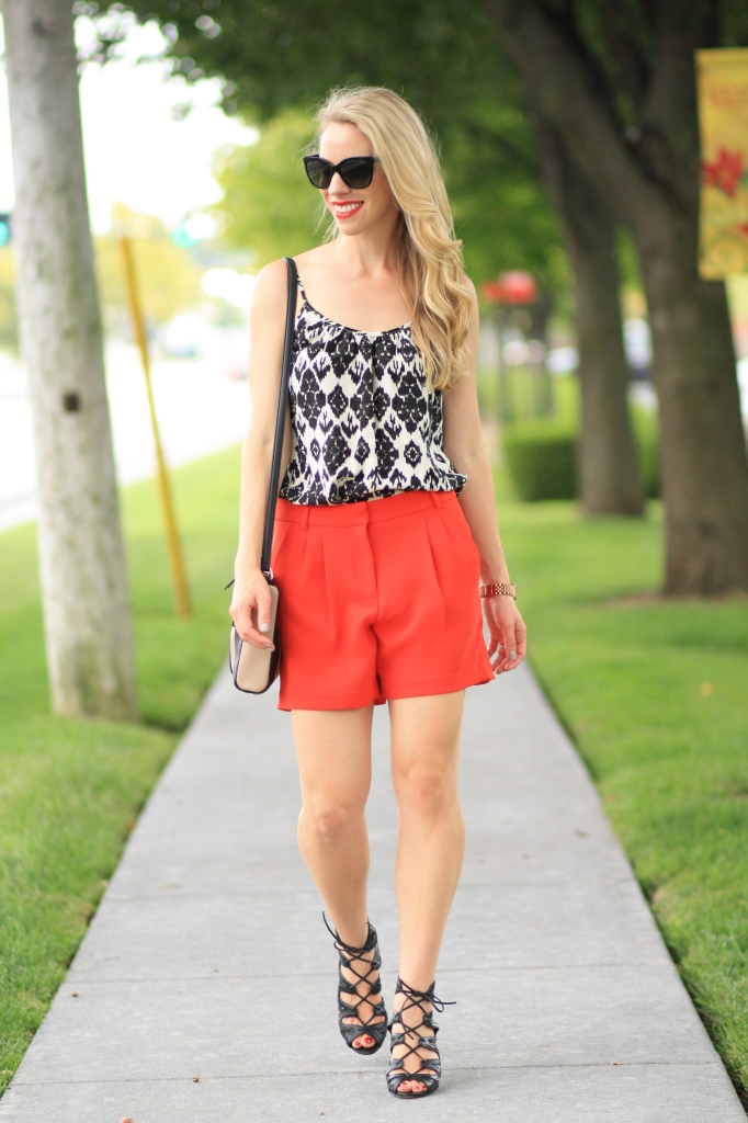 Chanel oversized cateye sunglasses, black and white with red outfit, LOFT ikat print camisole, J. Crew pleated city shorts, bright red shorts, black leather lace up booties