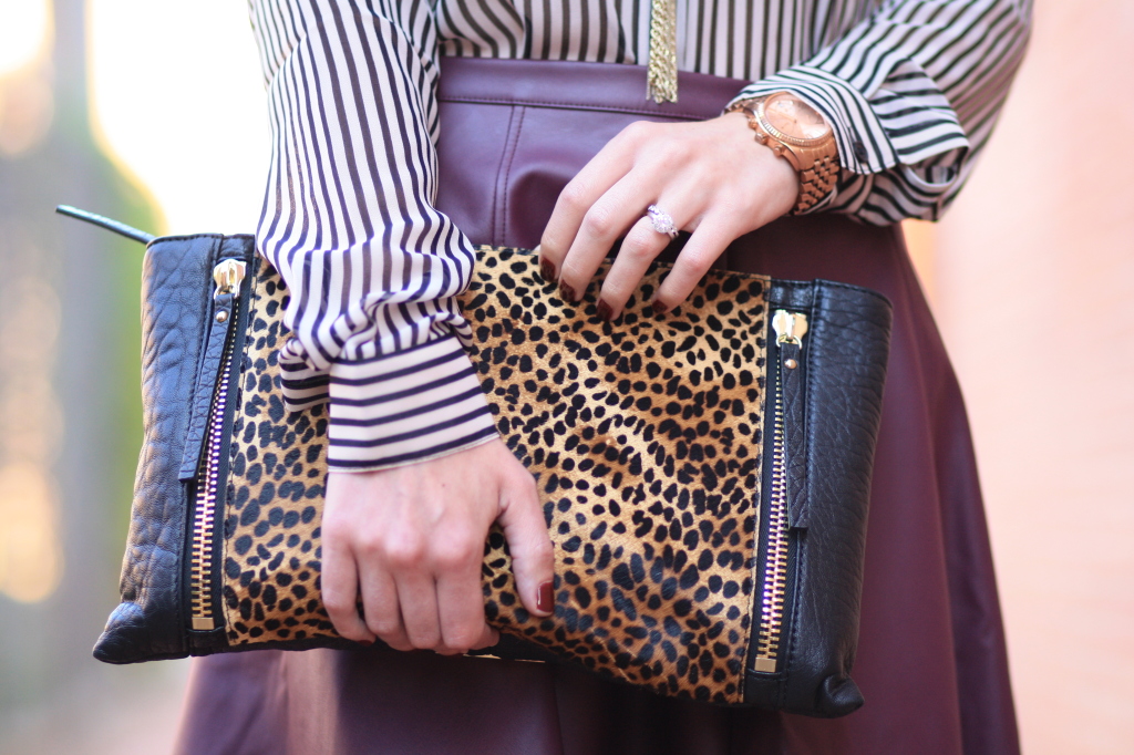 oversized leopard Vince Camuto clutch, burgundy leather, burgundy faux leather skirt, skater skirt, Essie 'berry naughty' nail polish, striped blouse with burgundy leather