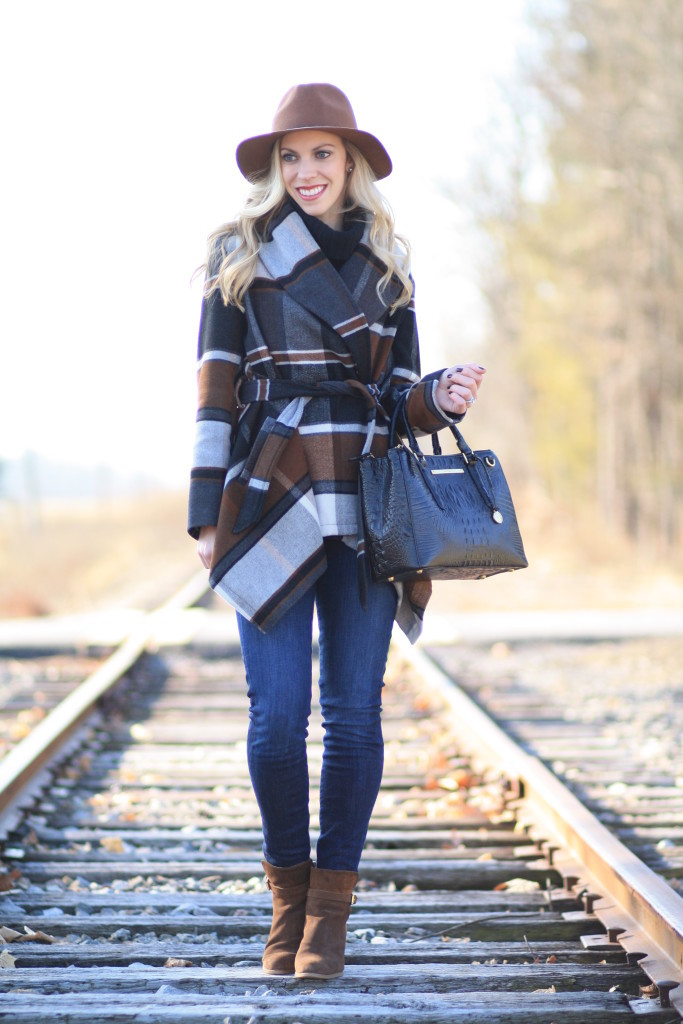 Chicwish plaid wrap coat, Brahmin small Lincoln satchel black melbourne, brown panama hat, dark skinny jeans, brown suede ankle boots, winter plaid outfit