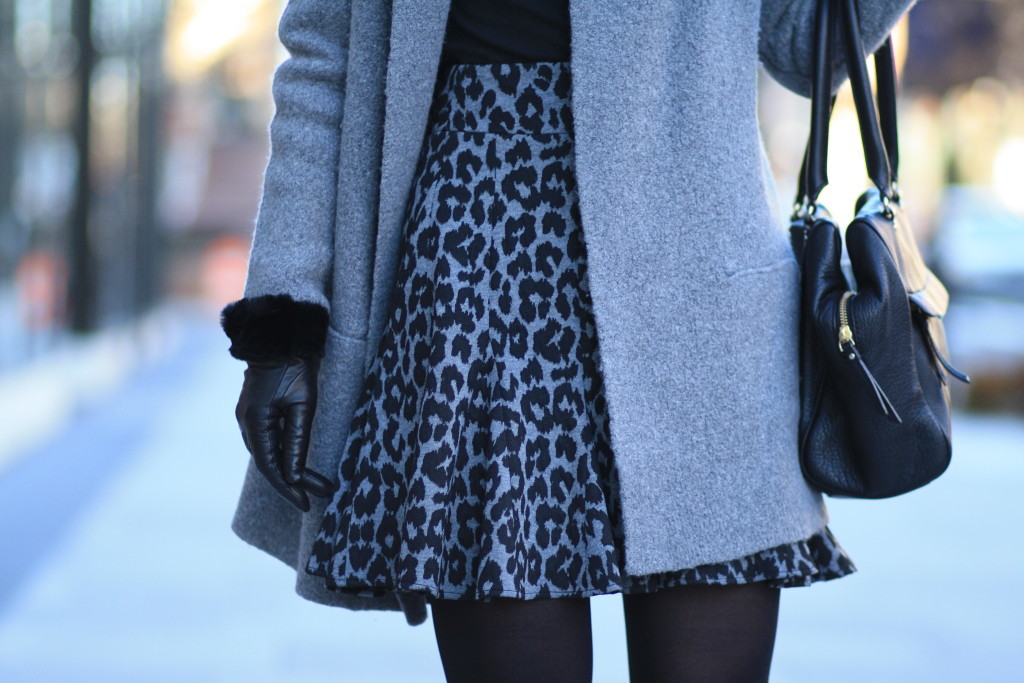 gray sweater coat, black turtleneck, UGG black leather shearling cuff gloves, Ann Taylor gray snow leopard flounce skirt, black and gray winter outfit