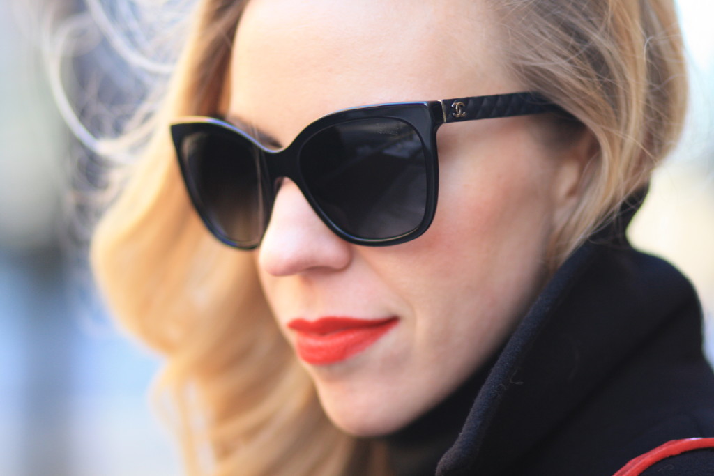 Chanel cateye sunglasses with quilted leather trim sides, Chanel black oversized sunglasses, Clinique soft matte crimson lipstick, dark sunglasses and bold red lip, glamorous