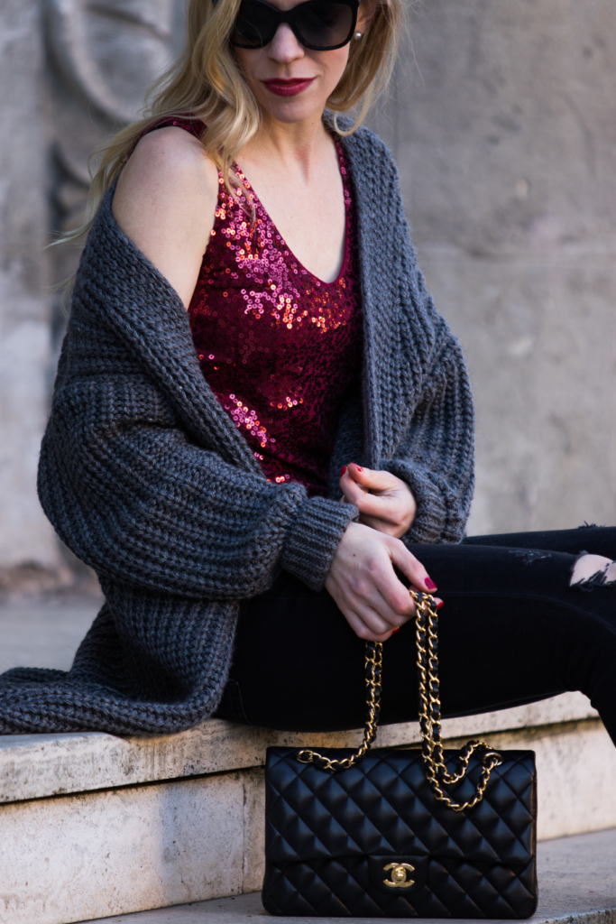 oversized-gray-cardigan-sweater-with-red-sequin-top-new-years-eve-outfit-with-sweater-and-sequin-top-chanel-medium-classic-flap-bag-black-and-gold