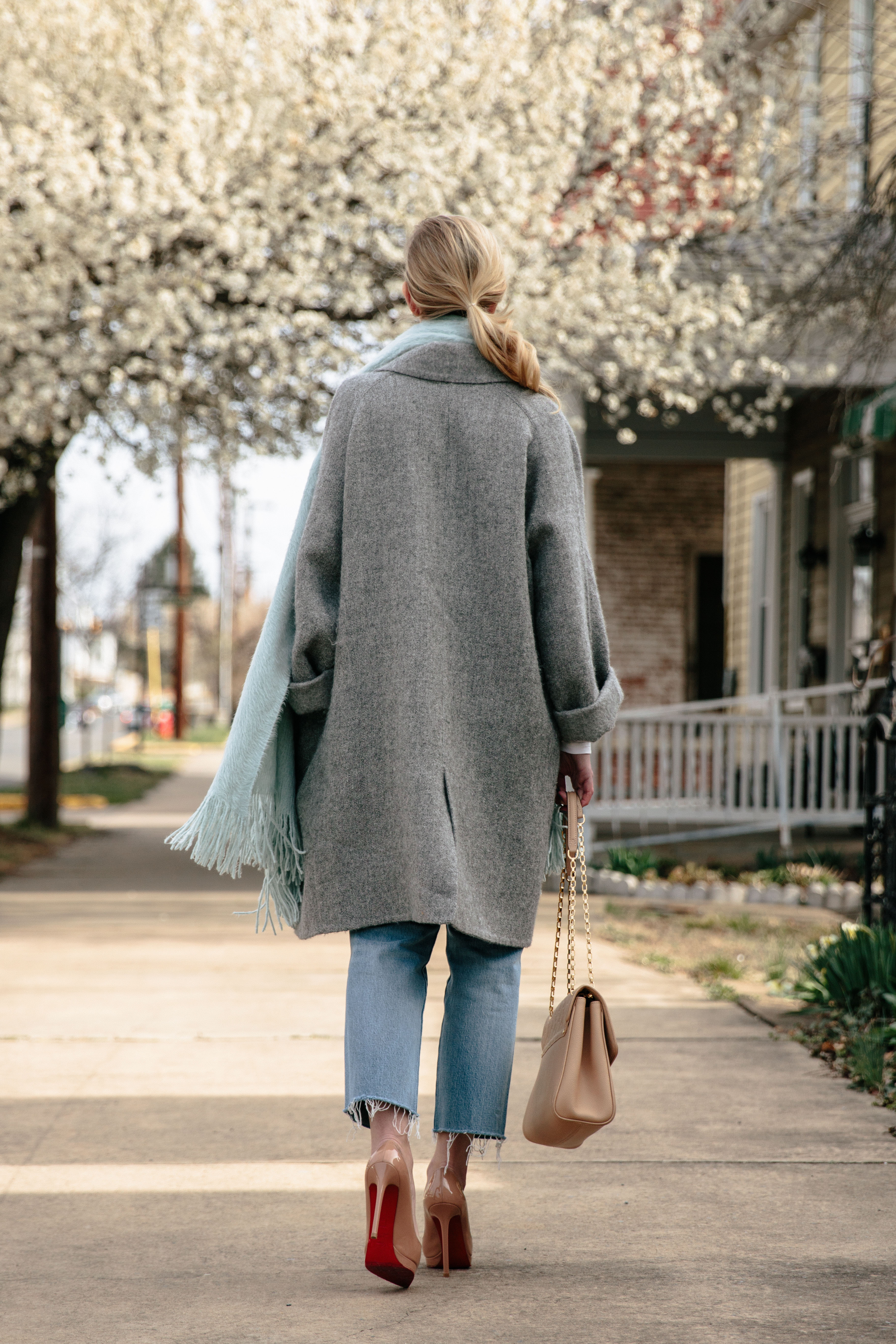 gray coat with mint scarf and Levi's straight leg cropped jeans