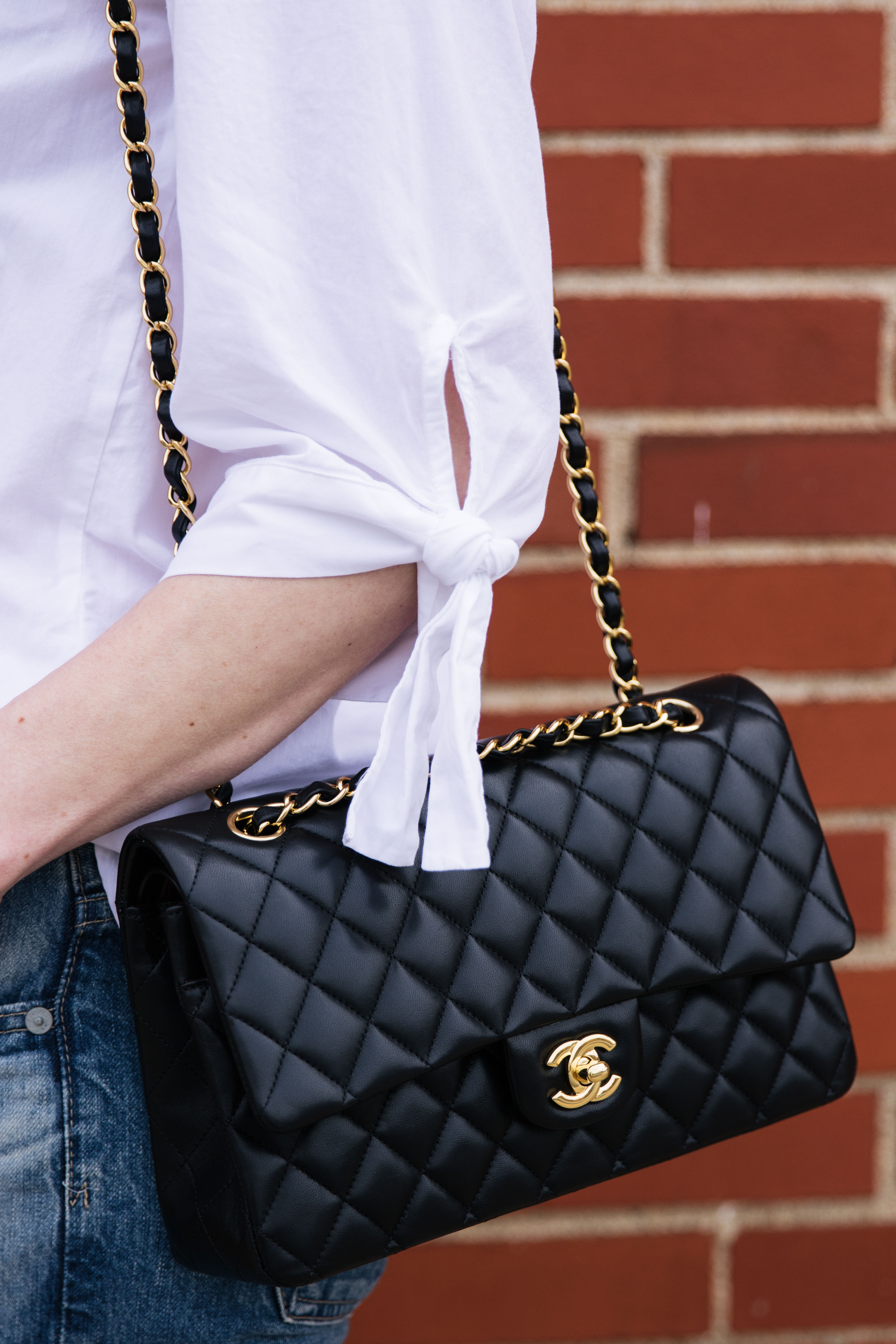Chanel medium classic flap bag black lambskin with gold hardware, tie