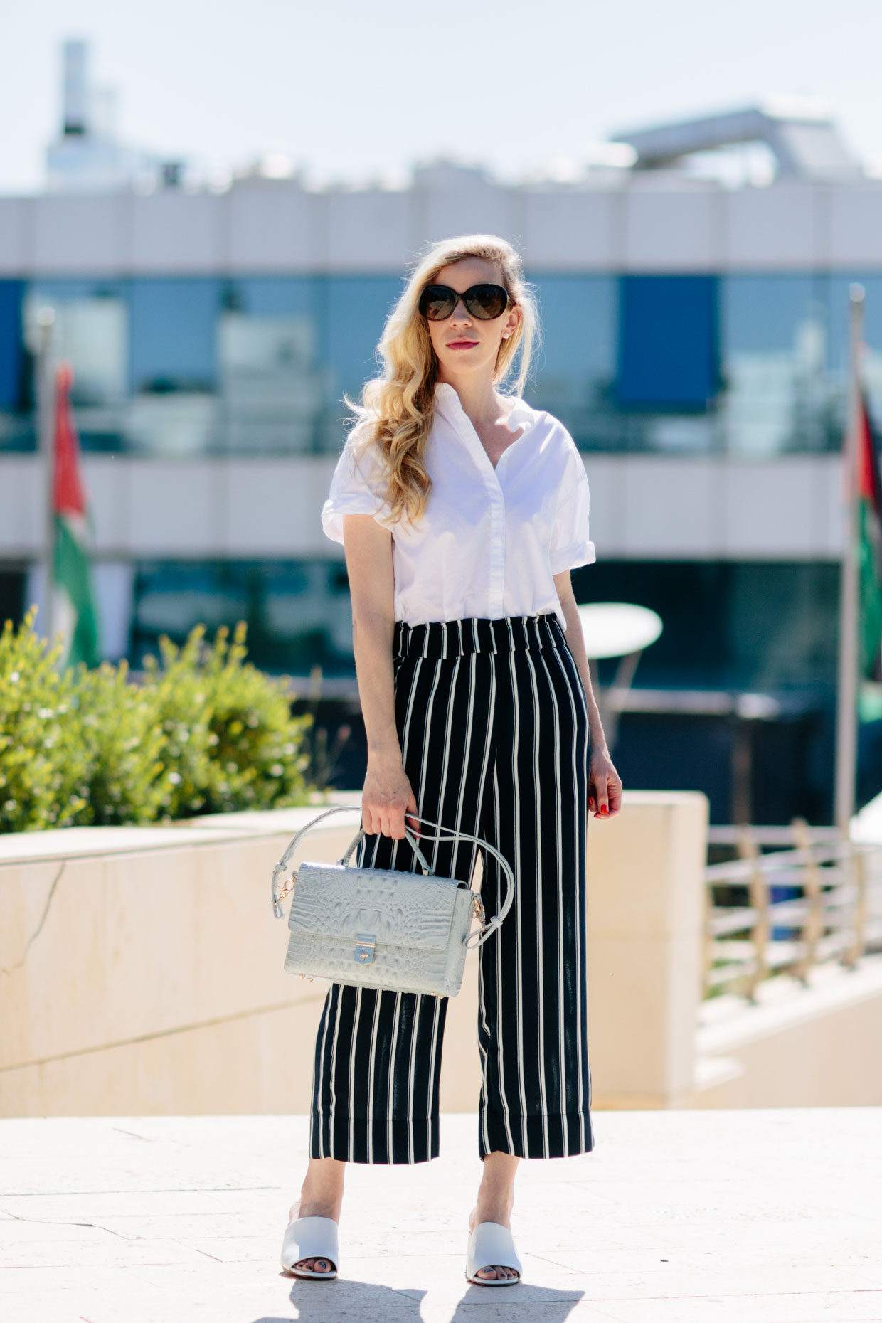 Woman in Whiteredandblue Striped Pants and Top  Free Stock Photo