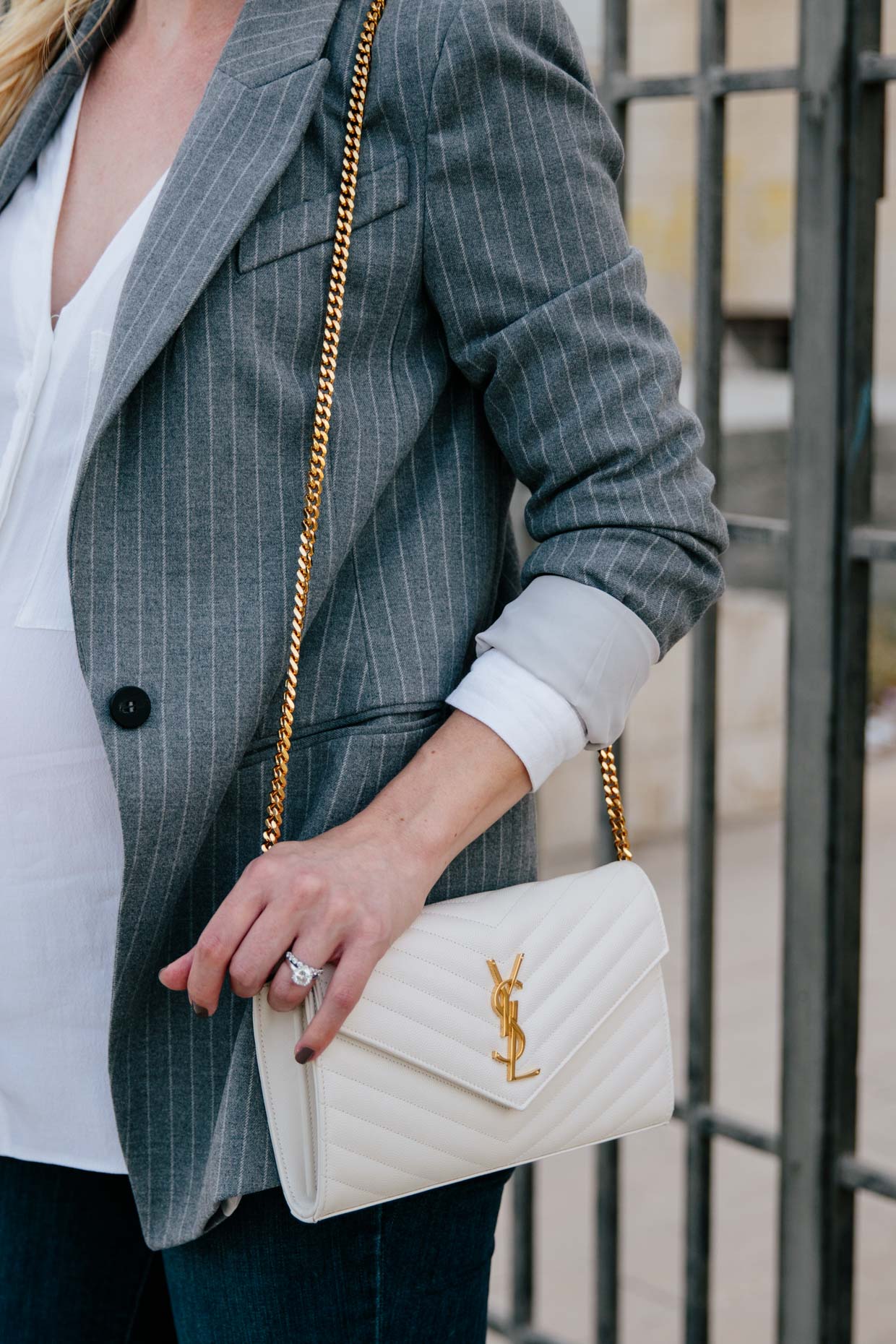 H&M navy blue jumpsuit, Saint Laurent white chain wallet handbag, YSL white envelope  clutch, halter jumpsuit outfit - Meagan's Moda