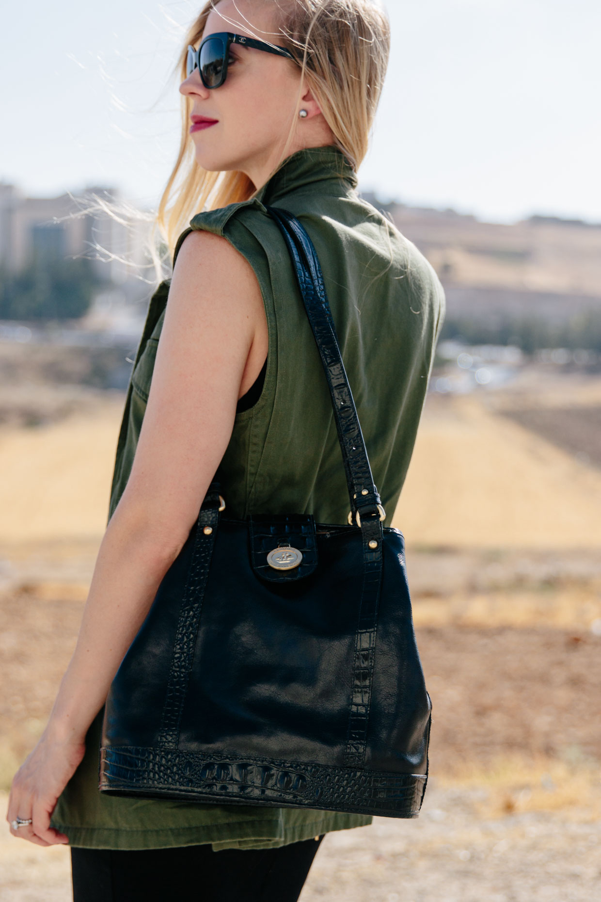 olive utility vest with gray tee and denim cutoff shorts, vintage Louis  Vuitton 'Passy' shoulder bag, utility vest outfit for fall - Meagan's Moda