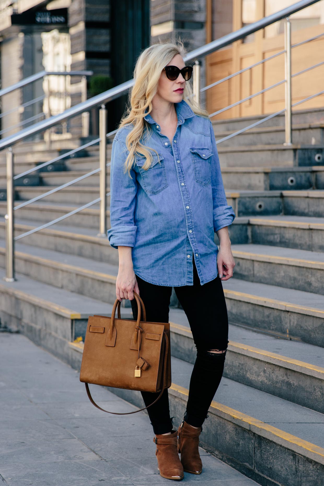 blue denim shirt and black jeans