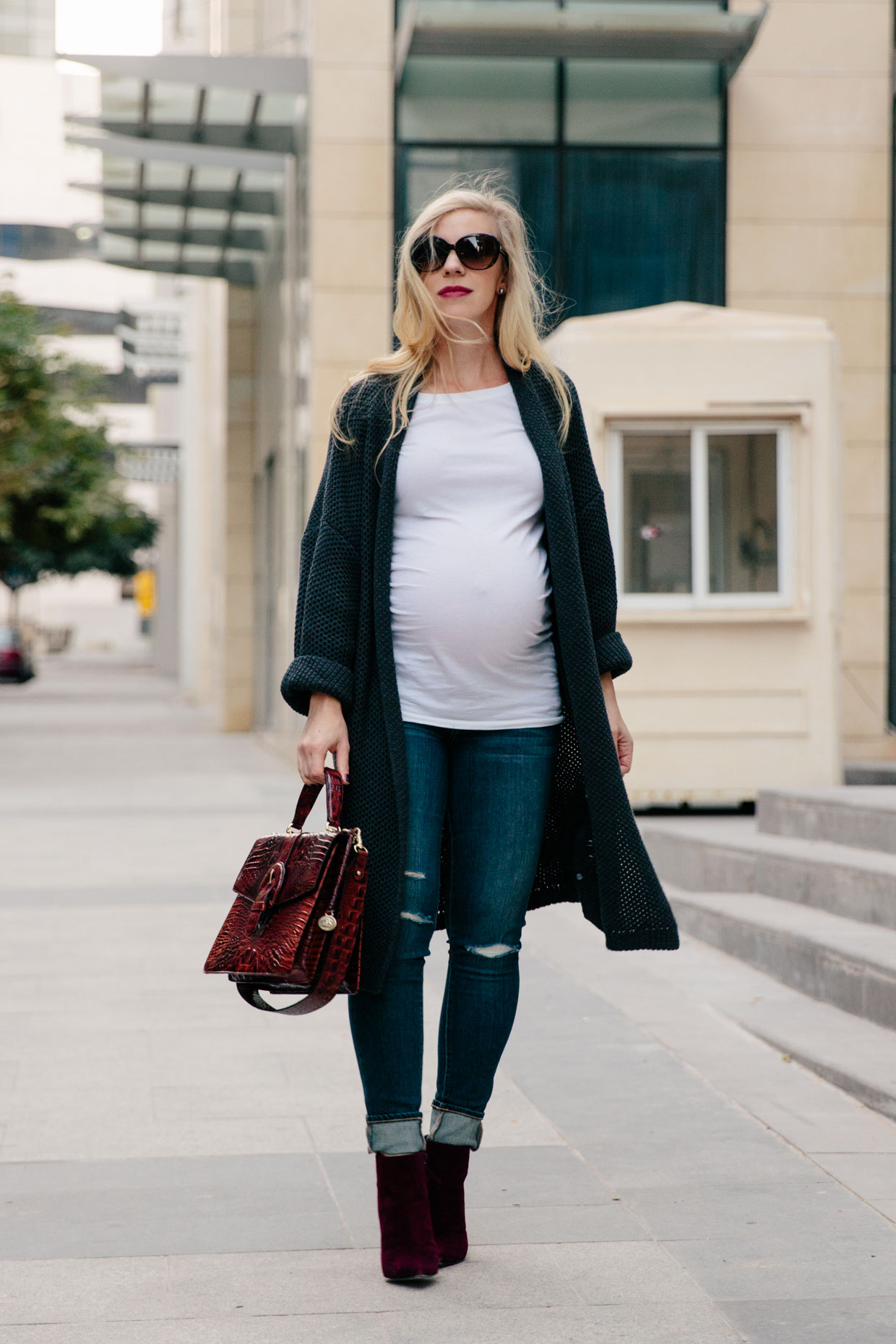 Meagan Brandon fashion blogger of Meagan's Moda wears Topshop rose sweater  dress with sock boots and Louis Vuitton monogram for chic fall maternity  outfit - Meagan's Moda