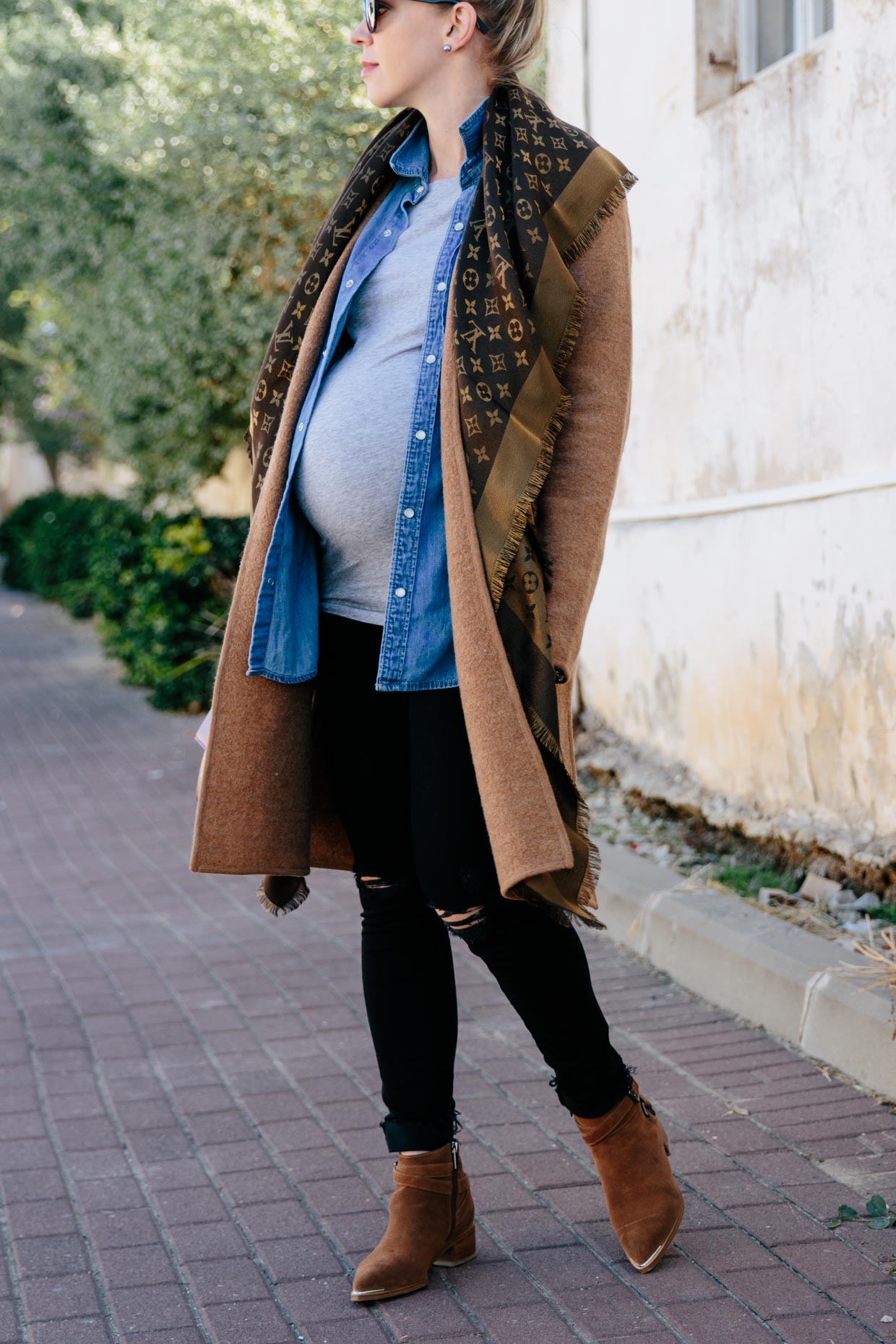 Meagan Brandon fashion blogger of Meagan's Moda wears layered fall  maternity outfit with Madewell camel sweater coat, Louis Vuitton brown  shiny monogram shawl scarf and denim shirt - Meagan's Moda