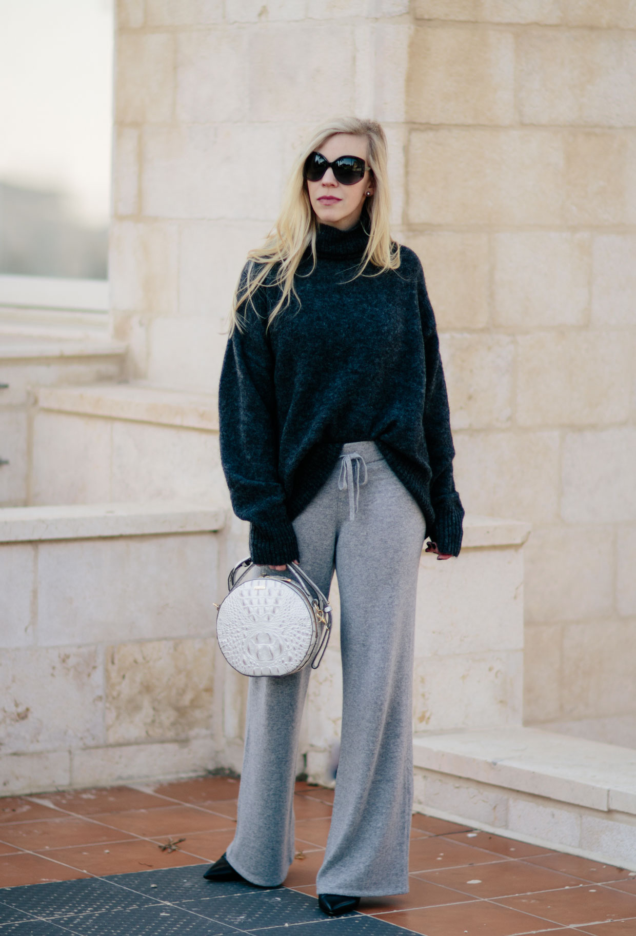 https://meagansmoda.com/wp-content/uploads/2018/01/Meagan-Brandon-fashion-blogger-of-Meagans-Moda-styles-oversized-turtleneck-with-wide-leg-gray-cashmere-pants-how-to-wear-dressy-cashmere-pants.jpg