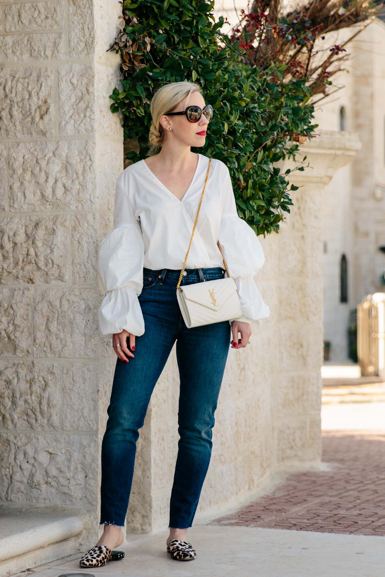 https://www.meagansmoda.com/wp-content/uploads/2018/03/Meagan-Brandon-fashion-blogger-of-Meagans-Moda-wears-white-lantern-sleeve-blouse-with-Levis-Wedgie-high-waist-jeans-and-leopard-mules-spring-outfit.jpg