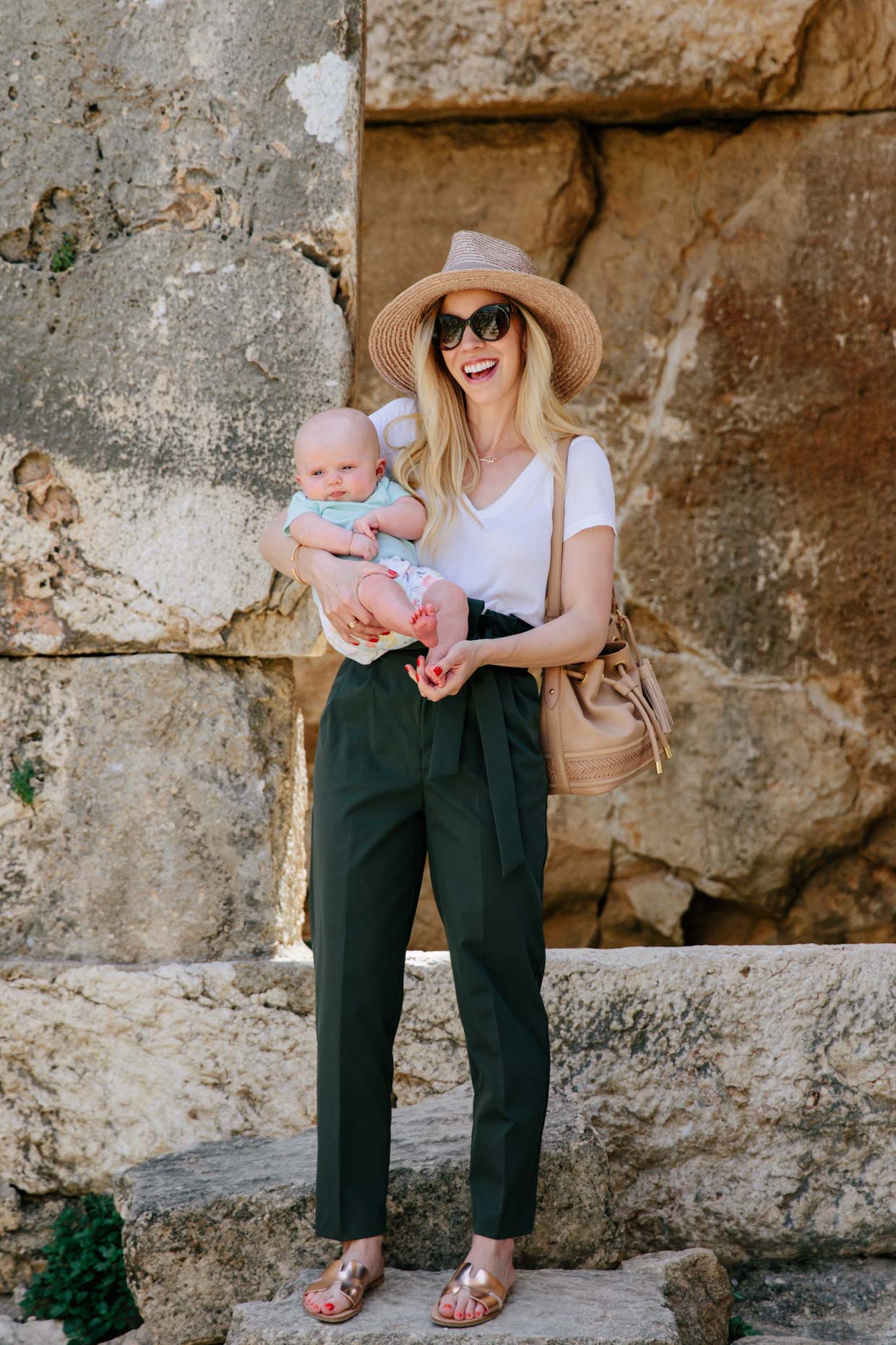 Cute casual summer travel outfit idea with white tee, straw hat and olive  paperbag waist pants - Meagan's Moda