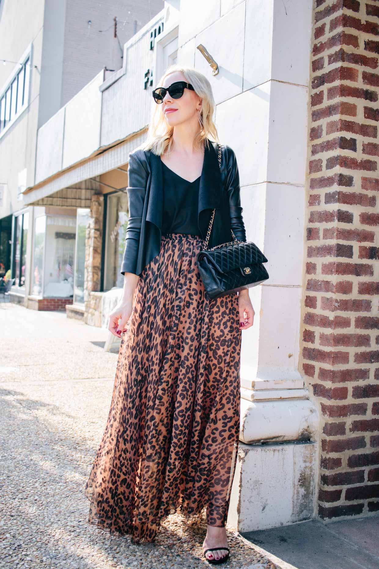 Meagan Brandon fashion blogger of Meagan's Moda shows leopard print  camisole outfit with black fluted midi skirt and red Saint Laurent high  school satchel - Meagan's Moda