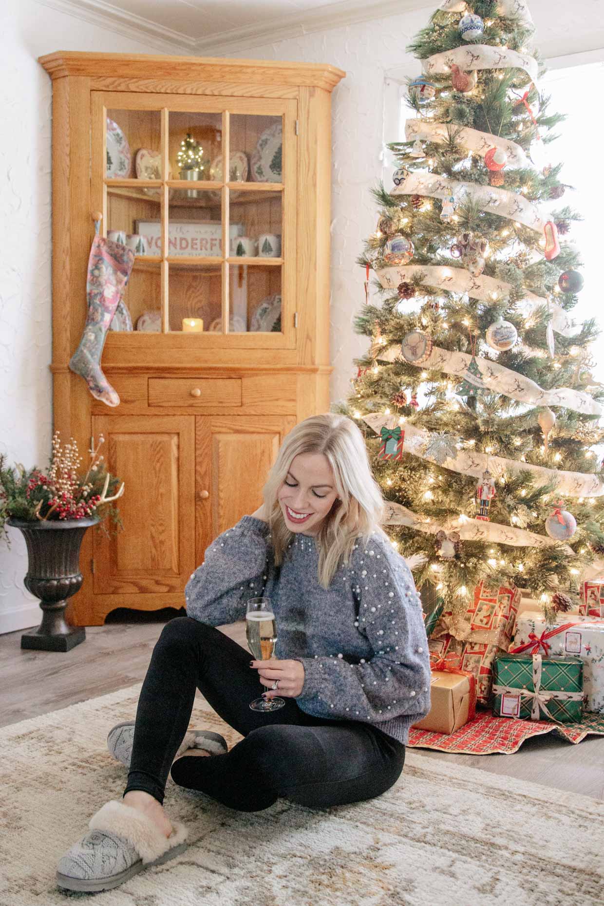 Meagan Brandon fashion blogger of Meagan's Moda wears pearl embellished  sweater with Spanx velvet leggings and Ugg Slippers for cozy holiday outfit  - Meagan's Moda