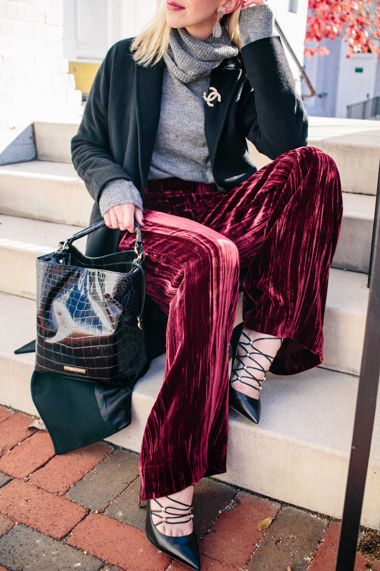 Meagan Brandon fashion blogger of Meagan's Moda wears gray oversized  turtleneck sweater with red velvet pants for chic cozy holiday outfit -  Meagan's Moda