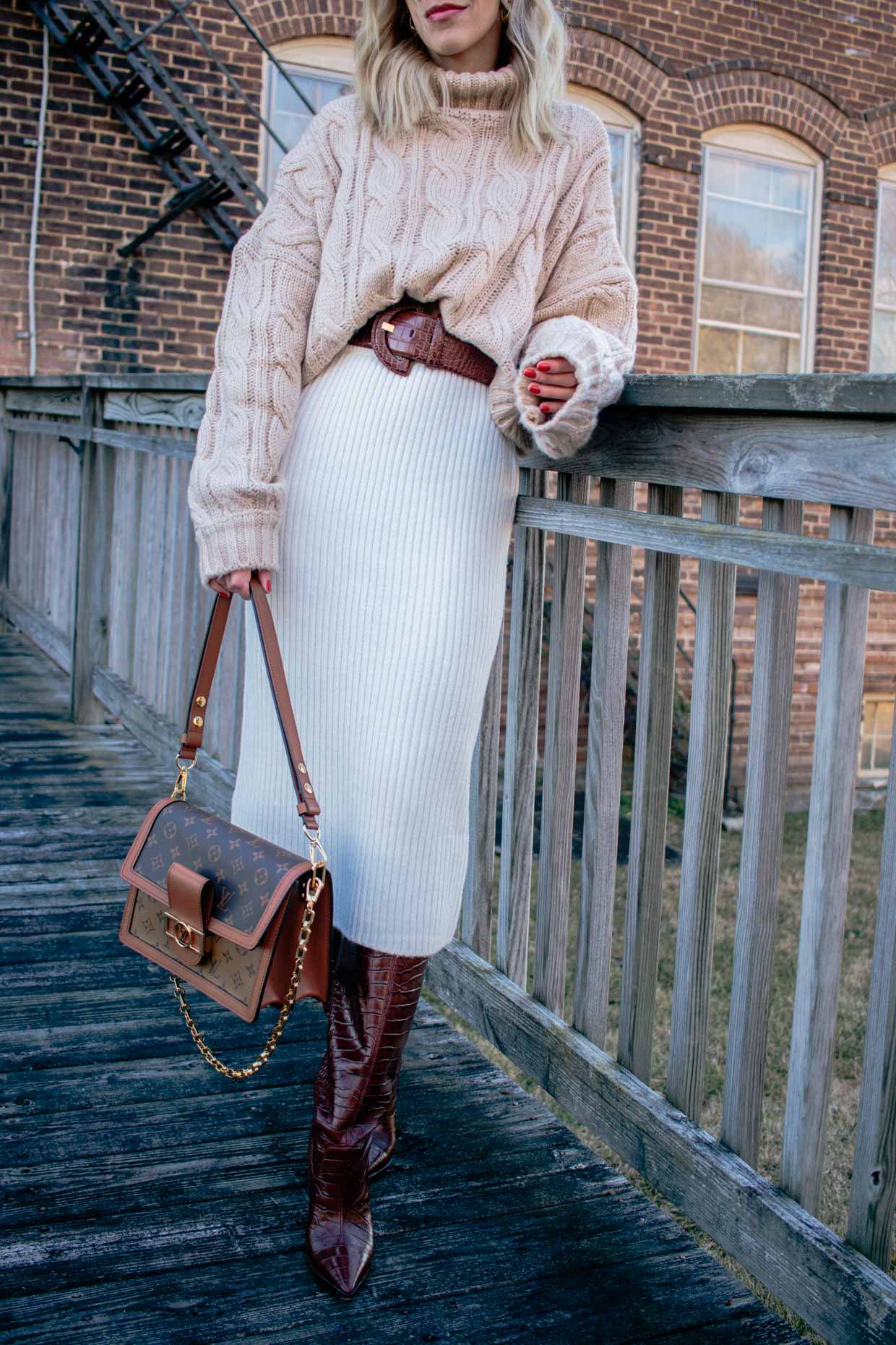 Meagan Brandon fashion blogger of Meagan's Moda wears rust colored poncho  with leather mini skirt, croc knee high boots and Louis Vuitton Dauphine -  Meagan's Moda