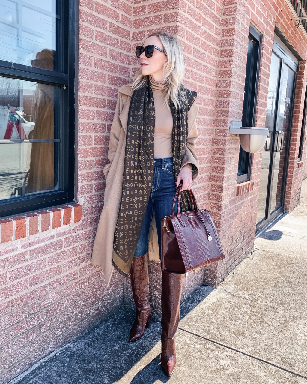 Meagan Brandon fashion blogger of Meagan's Moda wears Louis Vuitton brown shine  shawl monogram scarf with H&M belted plaid blazer and Saint Laurent suede  sac de jour - Meagan's Moda