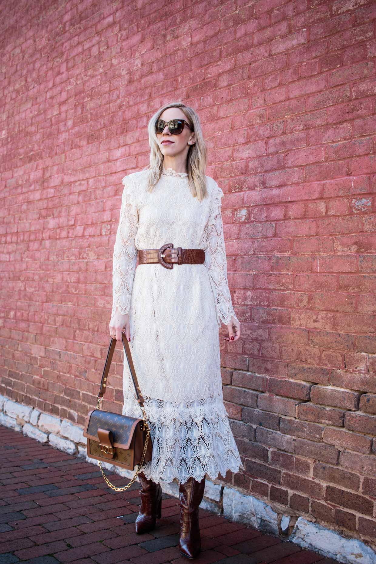 Meagan Brandon fashion blogger of Meagan's Moda wears cream lace midi dress  with croc belt, crob boots and Louis Vuitton Dauphine MM bag - Meagan's Moda