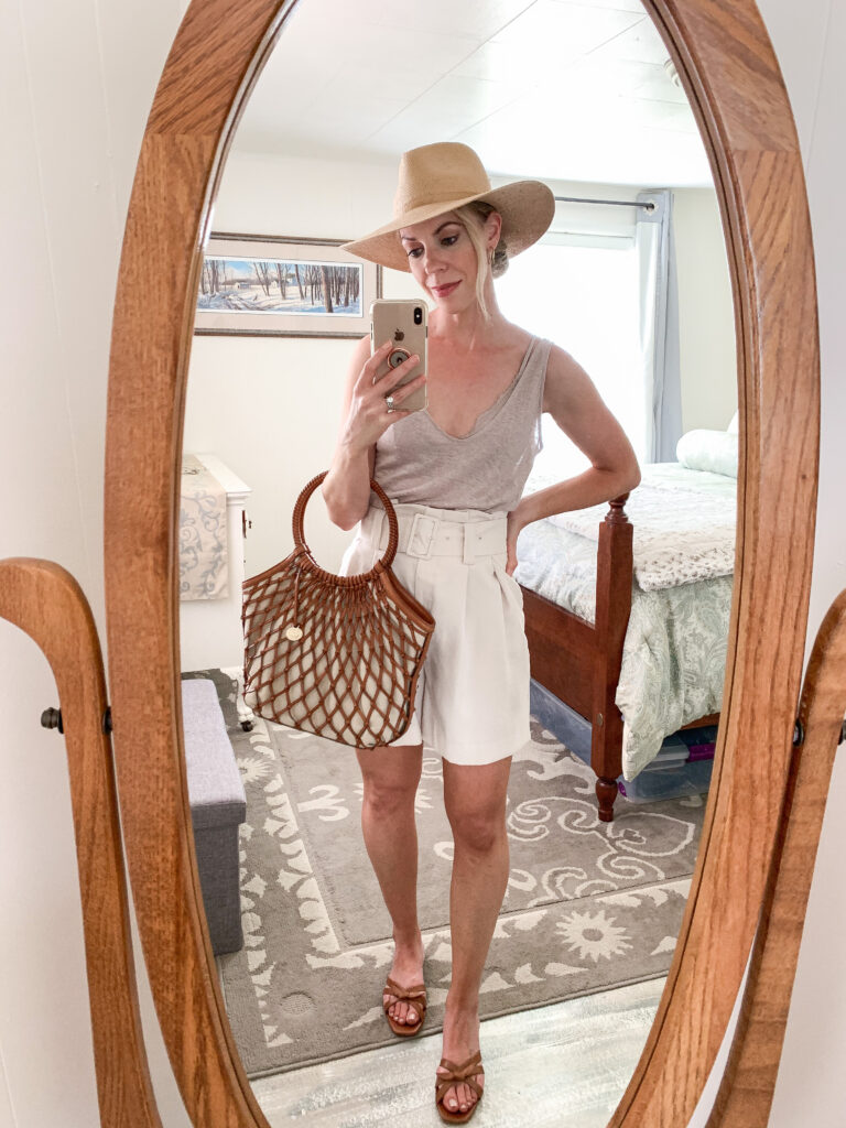 Meagan Brandon fashion blogger of Meagan's Moda shows how to wear paperbag shorts for summer with linen tank top