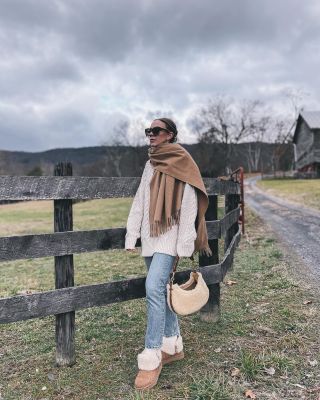 Meagan Brandon fashion blogger of Meagan's Moda shares farmhouse Christmas  porch decor idea wearing oversized sweater and Spanx velvet leggings - Meagan's  Moda